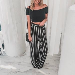 Black and white striped trousers. US 6